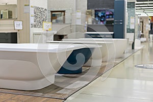 White and blue bathtubs in a hardware store. The concept of choosing and installing bathtubs