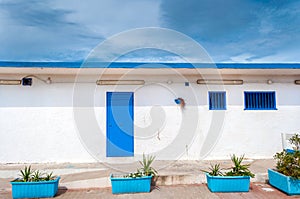 White and blue building on the beach