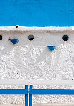 White and blue building on the beach