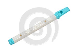 A white and blue children`s pipe on a white background, an isolated image. Children`s musical instrument