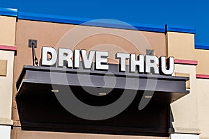 White and Blue Drive Thru sign set against a blue sky II