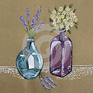 White and blue field flowers are in glass vases.