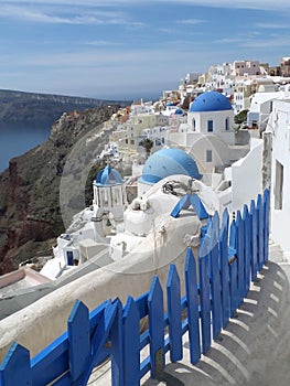 White and blue Greek Islands traditional churches architecture at Oia village, Santorini island