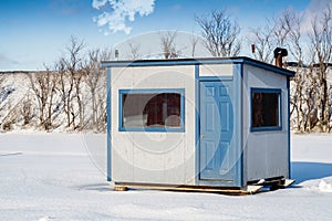 White and blue Ice Fishing Cabin