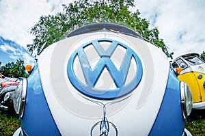The white and blue logo and the Volkswagen Transporter front view