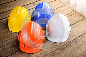White, blue, orange, yellow hard safety helmet construction hat