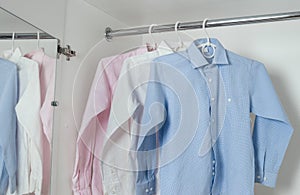 White, blue and pink clean ironed men's shirts