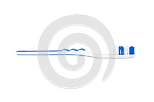 White-blue plastic toothbrush isolated on white background