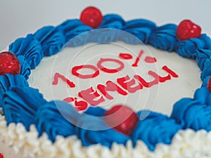 white blue red frosted icing cake isolated on studio white background photo