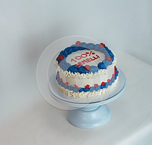 white blue red frosted icing cake isolated on studio white background photo