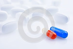 White, blue and red medicine antibiotic pills