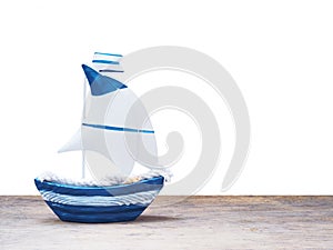 White and blue sailboat toy