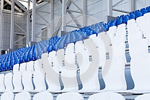 white and blue seats in the stadium.