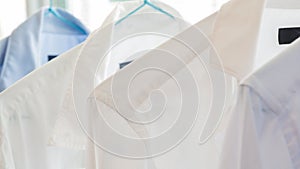 White and blue shirts at a dry cleaners