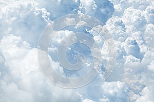 White & blue soft cumulus clouds in the sky close up background, big fluffy cloud texture, beautiful cloudscape skies backdrop