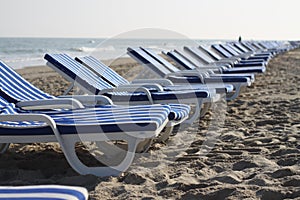 White and blue striped chairs on the beach part 2