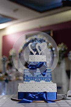 white and blue wedding cake three tiers photo
