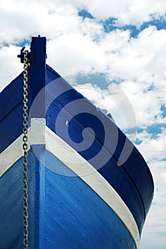 White and blue wooden boat