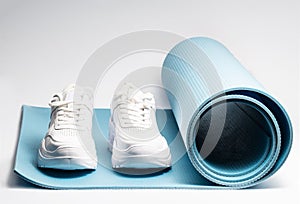 White on a blue yoga mat