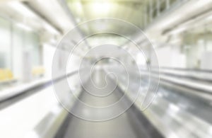 White blur light abstract background from interior escalator corridor building