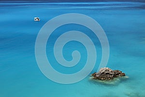 White boat in blue sea water