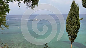 A white boat floats in the rented sea.