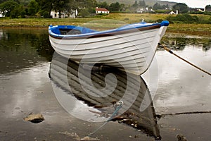 White boat during rainy day