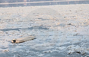 White boat trapped on the river Danube