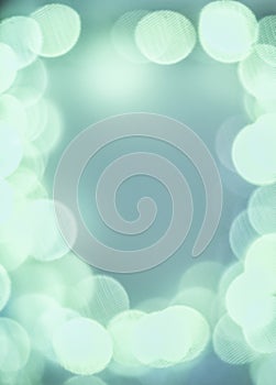 White bokeh circles with texture on turquoise background