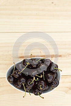 White bolw with ripe cherries