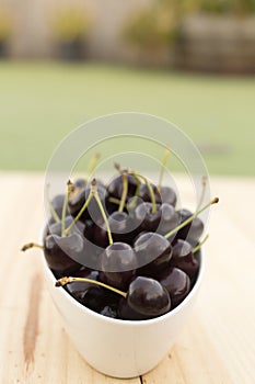 White bolw with ripe cherries