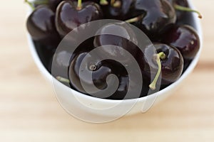 White bolw with ripe cherries
