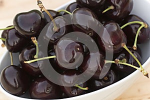 White bolw with ripe cherries