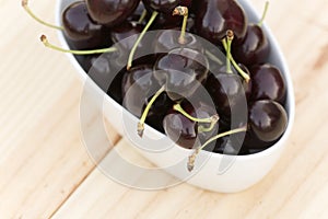 White bolw with ripe cherries