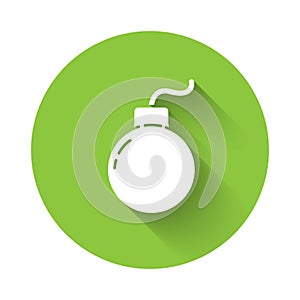 White Bomb ready to explode icon isolated with long shadow. Green circle button. Vector Illustration