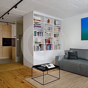 White bookcase in stylish apartment