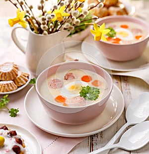 Polish Easter soup, white borscht with the addition of white sausage and a hard boiled egg. Traditional Easter dish in Poland