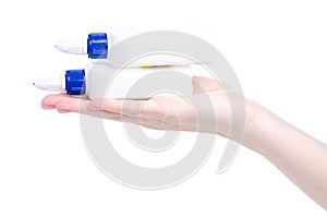 White bottle glue in hand