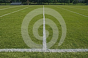 White boundary lines of football playing field photo