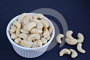 White bowl of cashew nuts