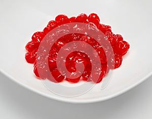 White bowl with delicious red dried cherries on a white background. Dried fruits as a healthy food