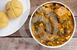 Delicious Nigerian dish Garri or eba with Oha soup photo