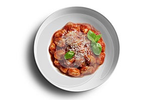 White bowl with tomato potato gnocchi