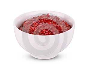 White bowl of tomato sauce or ketchup isolated on a white background