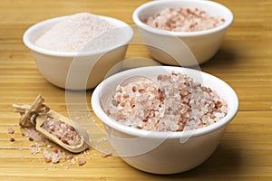 White bowls with coarse and fine pink sea salt