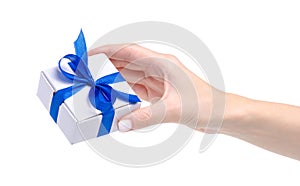 White box with blue ribbon bow gift in hand