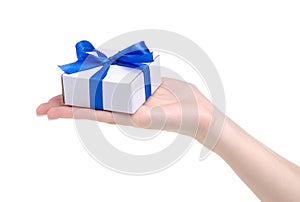 White box with blue ribbon bow gift in hand