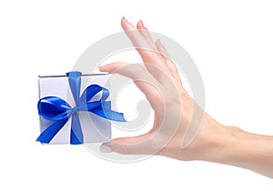 White box with blue ribbon bow gift in hand