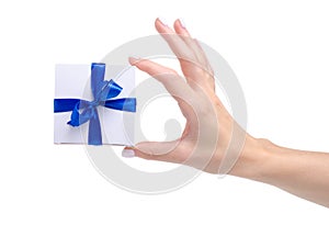 White box with blue ribbon bow gift in hand