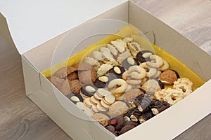 White box full of assorted christmas cookies